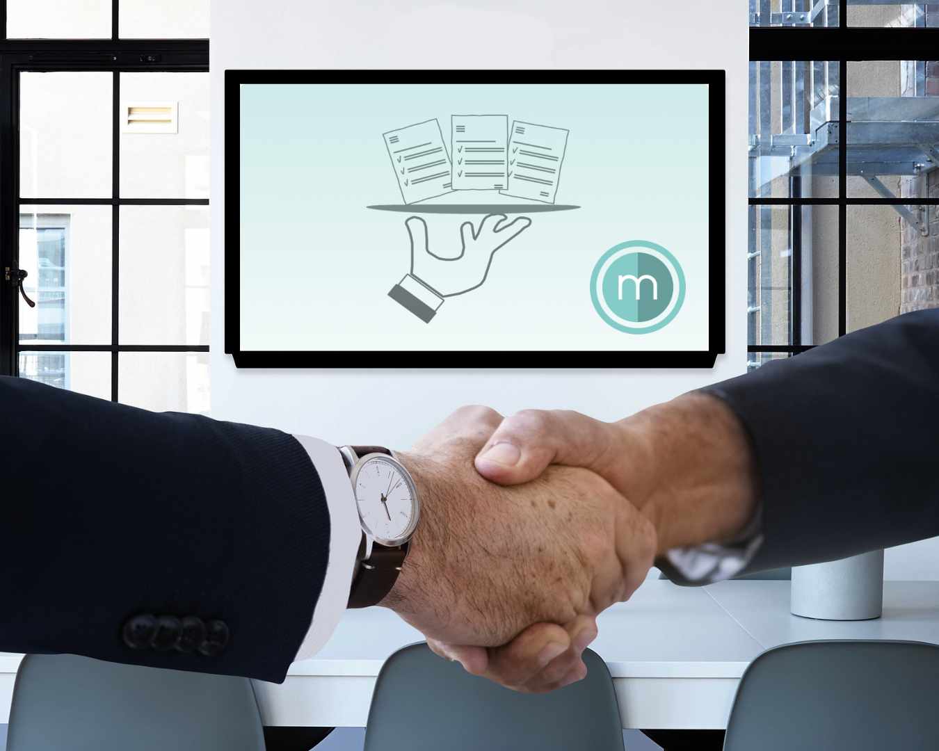 Handshake with MM logo